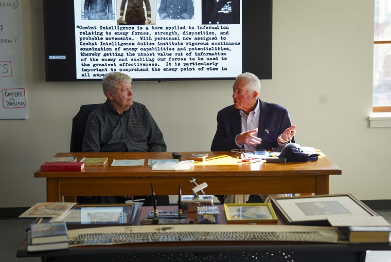 Two men sitting at a desk